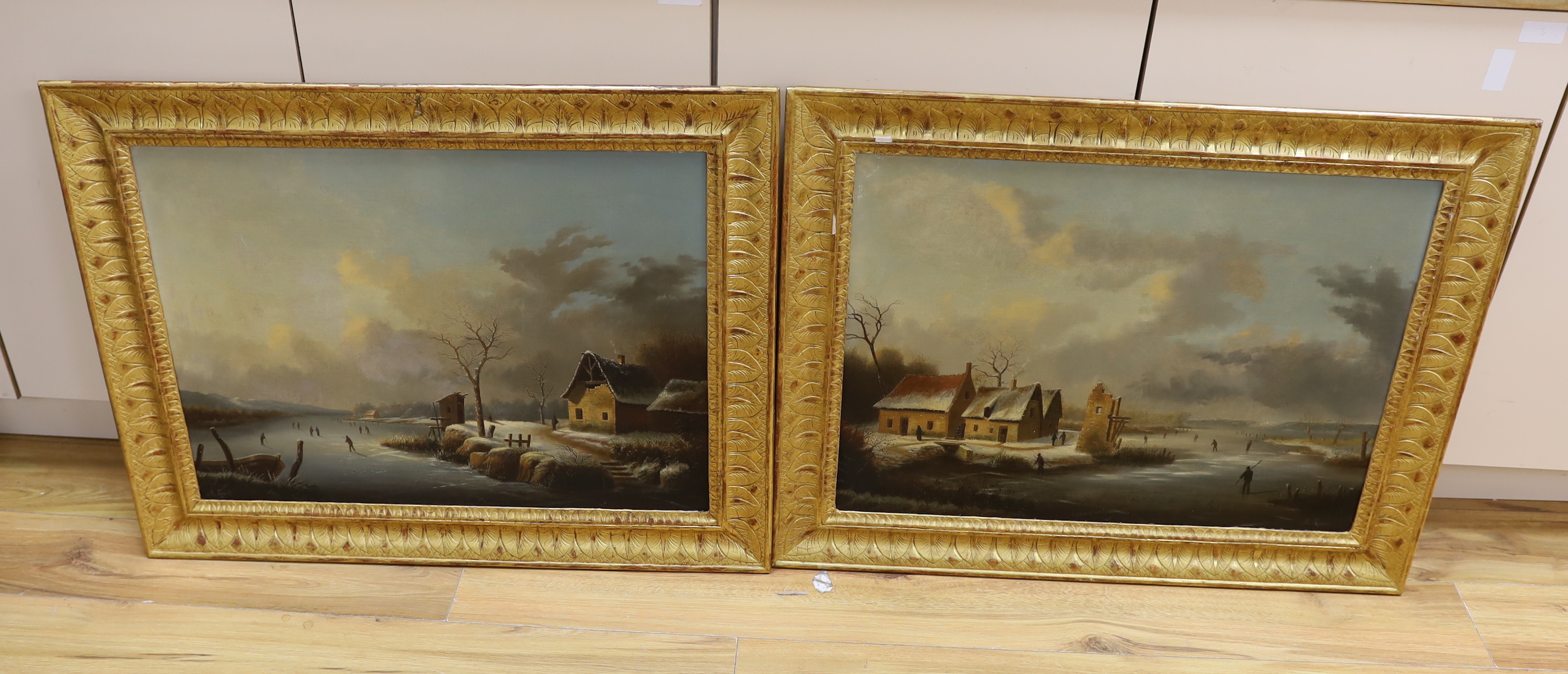 Albert Alexandre Lenoir (French, 1801-1891), pair of oils, Winter lake scenes with figures skating, signed, 67 x 51cm